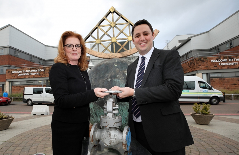 Siobhan McArdle, left, and Ben Houchen at James Cook University Hospital, holding a valve similar to the type that will be used in the district heating scheme
