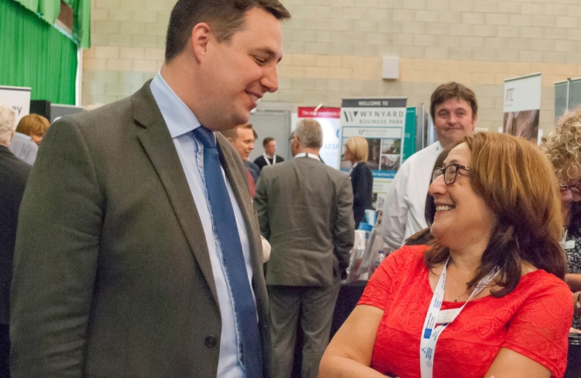 Tees Valley Mayor Ben Houchen speaking to an exhibitor at last year’s Business Summit, and right, exhibitors at last year’s Business Summit