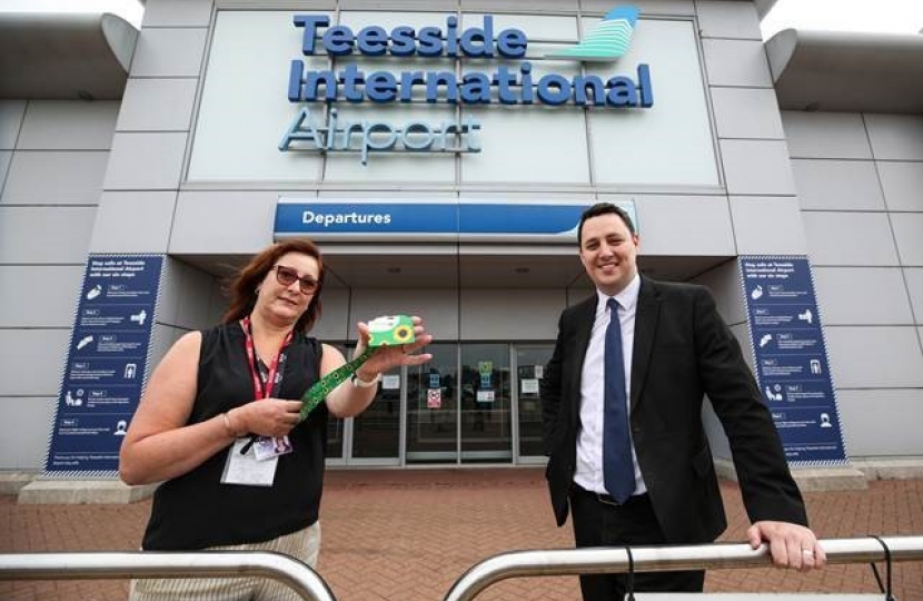 Helen Jaques with Mayor Houchen and a Sunflower scheme lanyard at Teesside International Airport