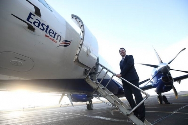 Tees Valley Mayor Ben Houchen boarding an Eastern Airways plane