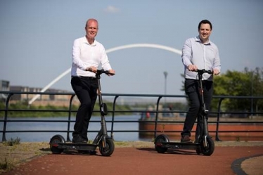 Paul Hodgins, left, with Tees Valley Mayor Ben Houchen on the e-scooters